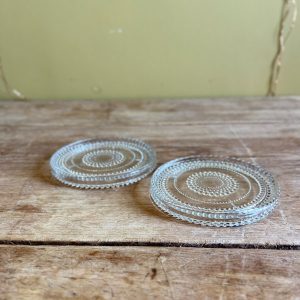 Paire de dessous de bouteille